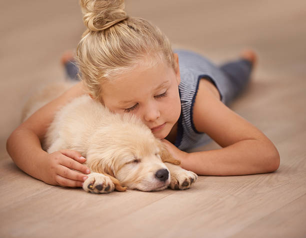 Cute baby with puppy | Mid-Michigan Floor Coverings